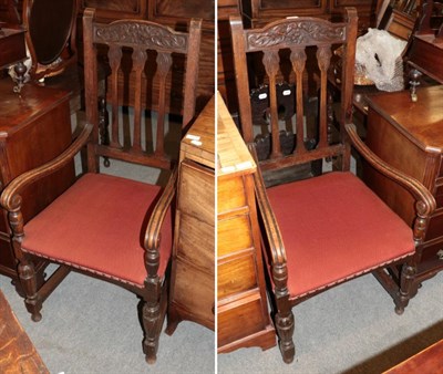 Lot 1281 - A pair of early 20th century oak armchairs