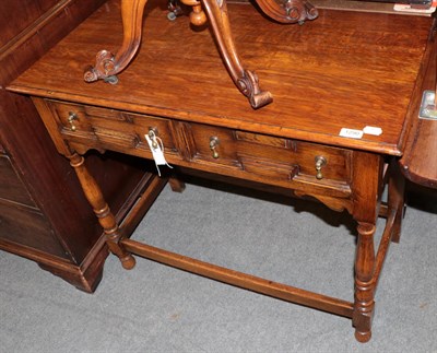 Lot 1290 - A 1920s oak side table in the 17th century style, fitted two drawers, 90cm wide