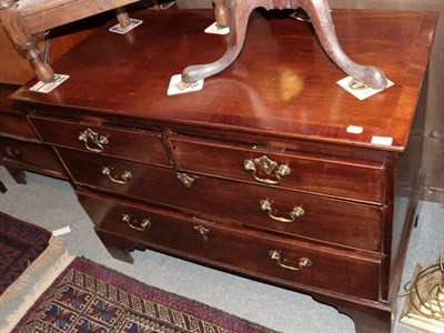 Lot 1298 - A George III mahogany and crossbanded four drawer chest on bracket feet, 116cm wide