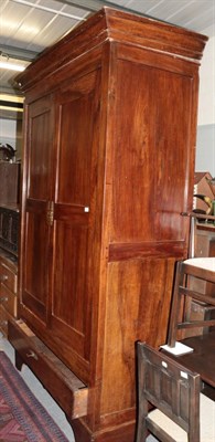 Lot 1301 - An 18th century French armoire with cupboard doors enclosing hanging space and a deep drawer to the