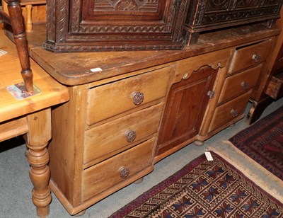 Lot 1303 - A Victorian pine sideboard with six drawers around a cupboard door, 160cm wide