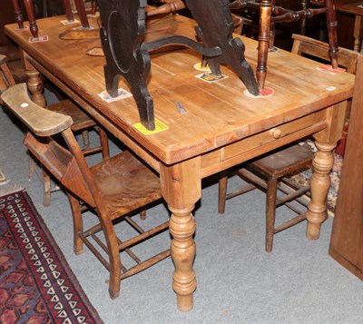 Lot 1305 - A pine kitchen table on turned legs, fitted one drawer, 180cm long