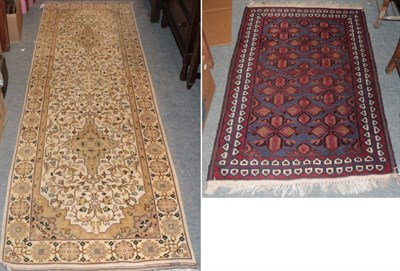 Lot 1307 - A Baluch rug, the field of flower head lattice design enclosed by raspberry borders, 135cm by 89cm