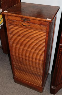 Lot 1309 - An early 20th century oak tambour front office cabinet