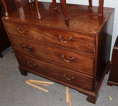 Lot 1316 - A George III mahogany three drawer chest on bracket feet, 106cm wide