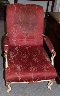 Lot 1324 - A 19th century painted and gilded armchair, covered in red and gold fabric, 65cm wide