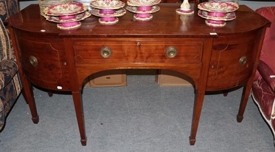 Lot 1325 - A George III mahogany breakfront sideboard on square tapering legs, formerly fitted a brass rail