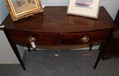 Lot 1333 - A George III mahogany bow fronted two drawer table, 112cm wide