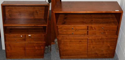 Lot 1353 - Two modern Starbay Indian rosewood cabinets, each with a recess above four drawers over a pair...