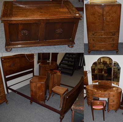 Lot 1362 - A 1930s walnut kidney shaped dressing table; matching linen chest; a pair of similar bedside...