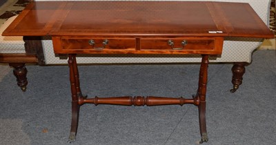 Lot 1366 - A reproduction yew wood and satinwood banded sofa table in the Regency style, 141cm long (extended)