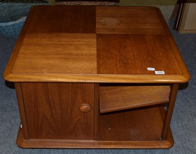 Lot 1380 - A 1970s 'Nathan' teak low coffee table with cupboard doors, raised on wheels