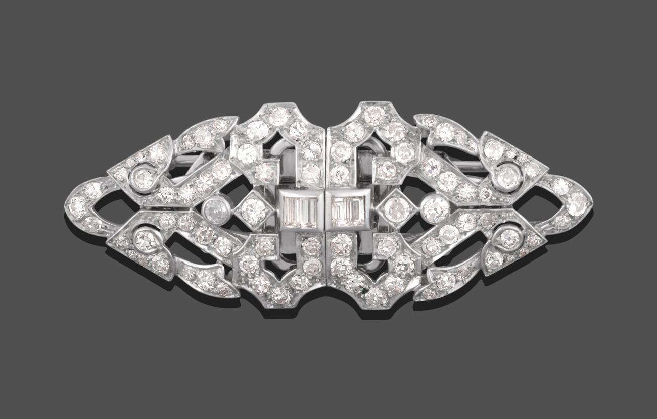 Lot 1002 - An Art Deco Diamond Double Clip Brooch, the geometric form inset with baguette cut, old cut and...