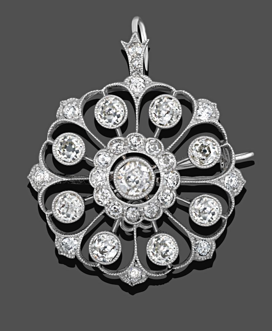Lot 1004 - A Diamond Brooch/Pendant, circa 1910, an old cut diamond centrally within a border of smaller...
