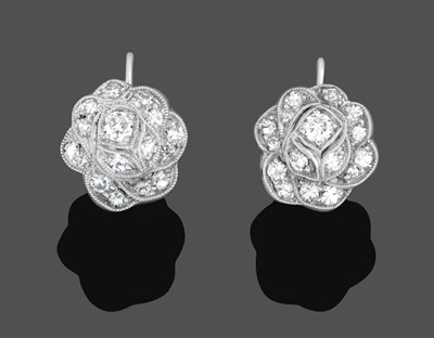 Lot 1005 - A Pair of Diamond Cluster Earrings, the floral motifs set with brilliant cut and eight-cut diamonds