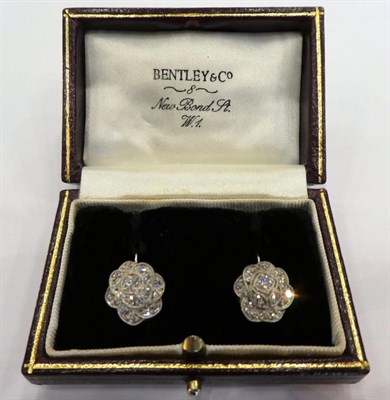 Lot 1005 - A Pair of Diamond Cluster Earrings, the floral motifs set with brilliant cut and eight-cut diamonds