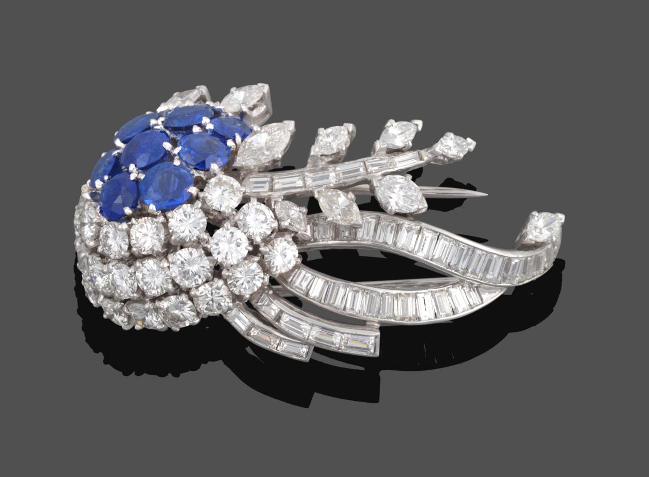 Lot 1015 - A Diamond and Sapphire Brooch, circa 1950, of stylised floral form set with round cut...