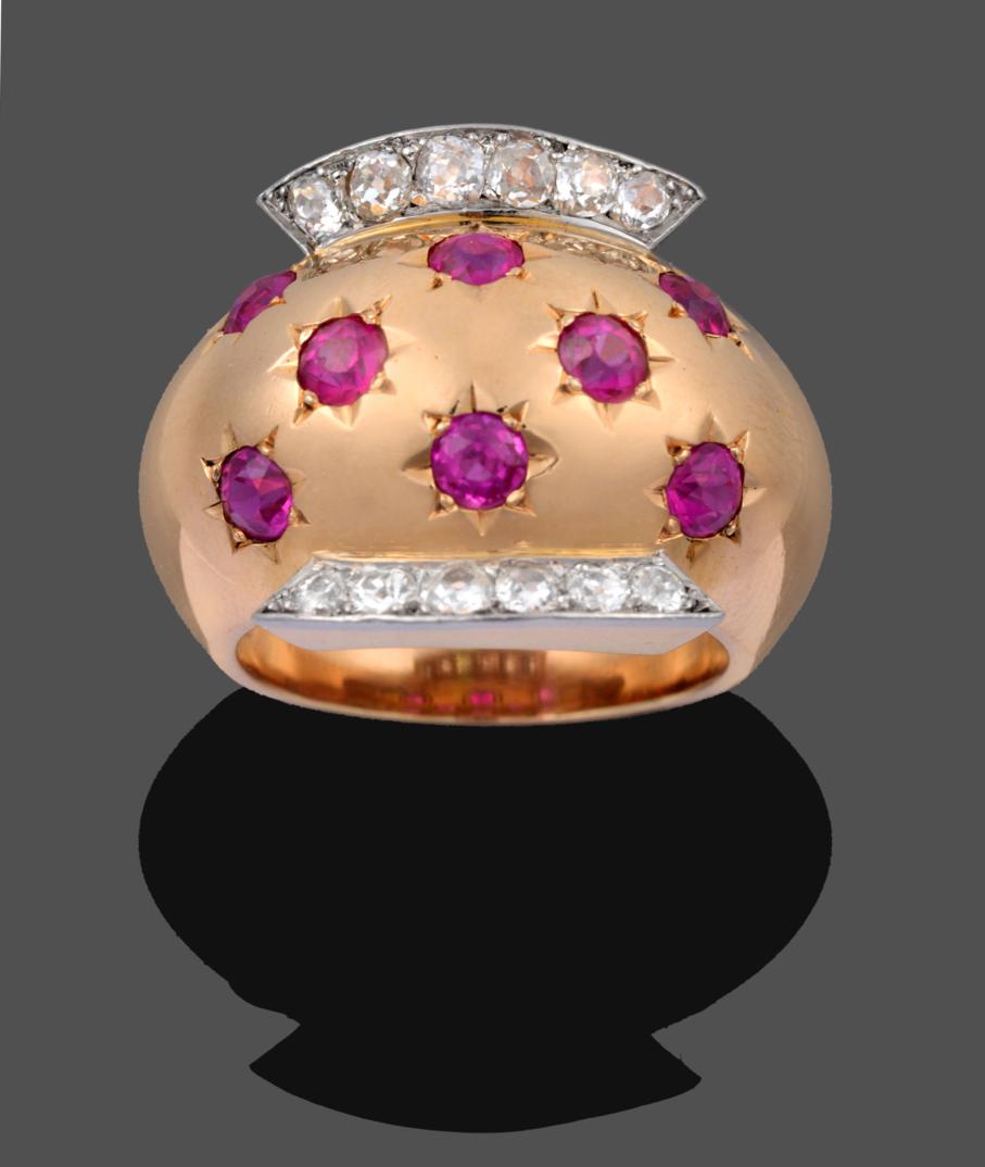 Lot 1036 - A Ruby and Diamond Ring, by Van Cleef & Arpels, eight old cut rubies in yellow star settings,...