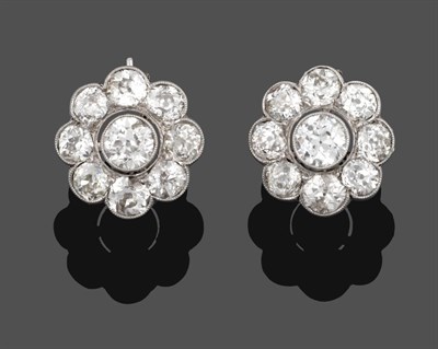 Lot 1043 - A Pair of Diamond Cluster Earrings, an old cut diamond within a border of eight smaller old cut...