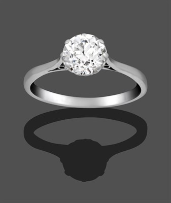 Lot 1054 - A Diamond Solitaire Ring, the old cut diamond in a white claw setting on a tapered shoulder...