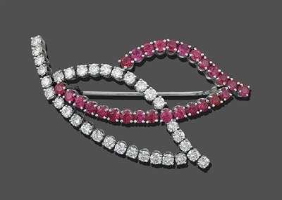 Lot 1065 - A Ruby and Diamond Brooch, in the form of two leaves, one outline set throughout with round...
