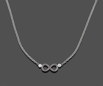 Lot 1066 - A Diamond 'Infinity' Necklace, the white infinity symbol terminates to a round brilliant cut...