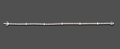 Lot 1070 - A Diamond Line Bracelet, bar links set with nine old cut diamonds in white square claw and...