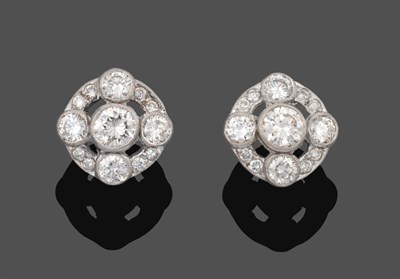 Lot 1071 - A Pair of Diamond Cluster Earrings, a round brilliant cut diamond within a border of four...
