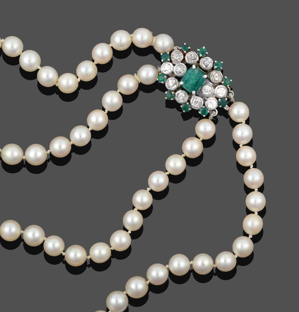 Lot 1074 - A Two Row Cultured Pearl Necklace, the 63:67 cultured pearls knotted to an oval clasp comprising of