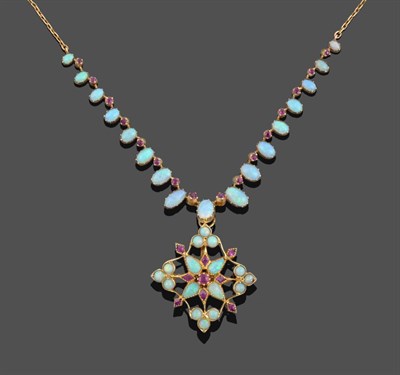Lot 1078 - An Opal and Ruby Necklace with a Detachable Opal and Ruby Brooch/Pendant, graduated oval...