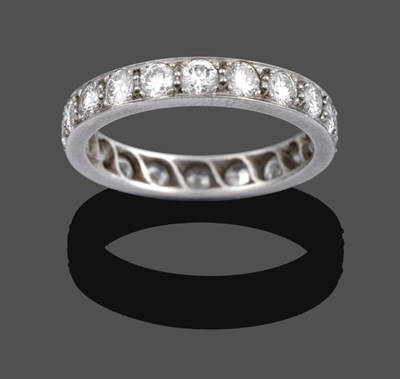 Lot 1089 - A Diamond Eternity Ring, the round brilliant cut diamonds in white claw and channel settings,...