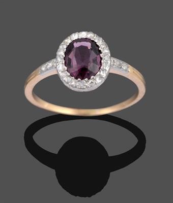 Lot 1094 - A Spinel and Diamond Cluster Ring, the oval mixed cut spinel within a border of rose cut...