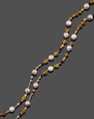 Lot 1104 - An Amber and Cultured Pearl Necklace, vari-shaped amber beads spaced by cultured pearls, length...