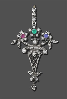 Lot 1111 - A Diamond, Ruby, Sapphire and Emerald Pendant, a rose cut diamond set bale suspends a trio of...