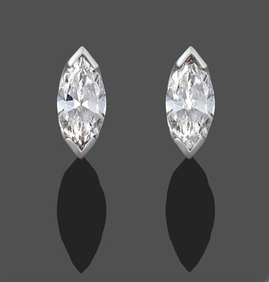 Lot 1114 - A Pair of 18 Carat White Gold Diamond Solitaire Earrings, each stud with a marquise cut diamond...