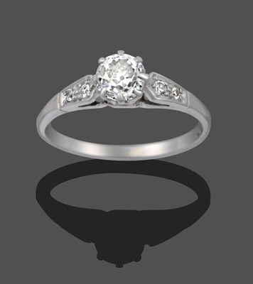 Lot 1135 - A Diamond Solitaire Ring, the old cut diamond in a white claw setting, to pairs of graduated...