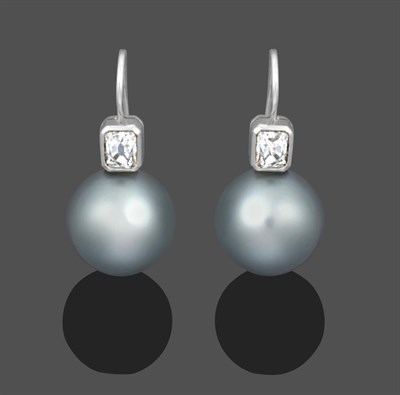 Lot 1136 - A Pair of Grey Cultured Pearl and Diamond Drop Earrings, a cushion cut diamond in a white...