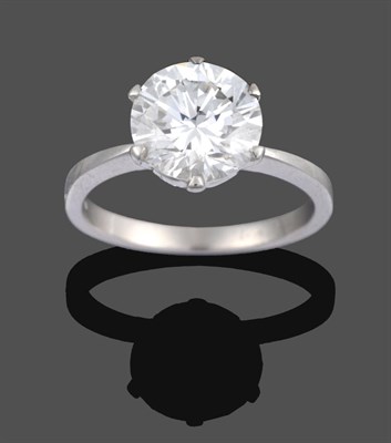 Lot 1137 - A Diamond Solitaire Ring, the round brilliant cut diamond in a white claw setting with a pear...