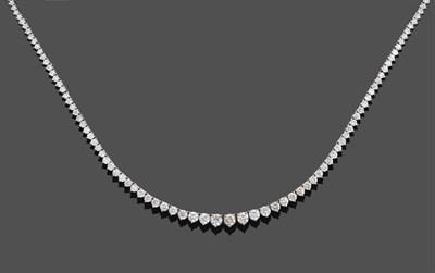 Lot 1138 - A Diamond Rivière Necklace, the graduated round brilliant cut diamonds in white claw settings,...