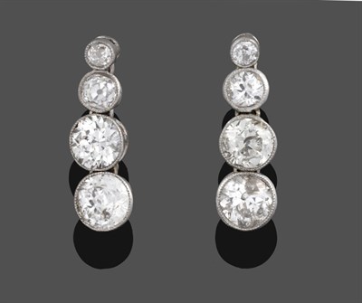 Lot 1139 - A Pair of Diamond Drop Earrings, four graduated old cut diamonds in white millegrain settings,...