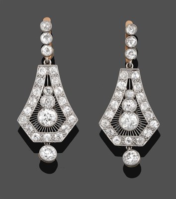 Lot 1140 - A Pair of Diamond Drop Earrings, a trio of old cut diamonds suspends a kite-shaped plaque with...