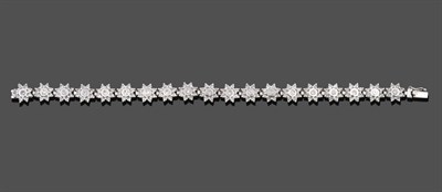 Lot 1144 - An 18 Carat White Gold Diamond Bracelet, nineteen articulated round brilliant cut diamond...