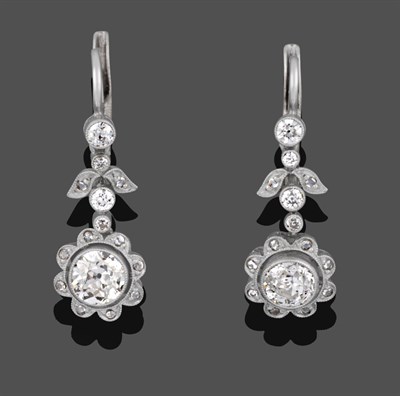 Lot 1148 - A Pair of Diamond Drop Earrings, four graduated old cut diamonds spaced by a diamond set floral...