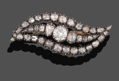 Lot 1152 - A Georgian Diamond Brooch, the asymmetric form of a central row of graduated old cut and rose...