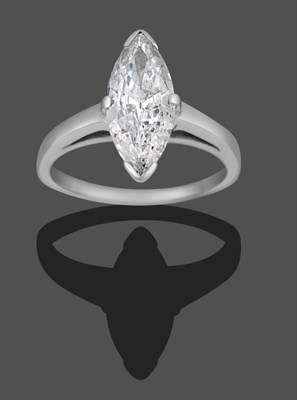 Lot 1156 - A Diamond Solitaire Ring, the marquise cut diamond in a white claw setting, to a tapered...