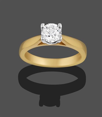 Lot 1158 - An 18 Carat Gold Diamond Solitaire Ring, the round brilliant cut diamond in a white claw...