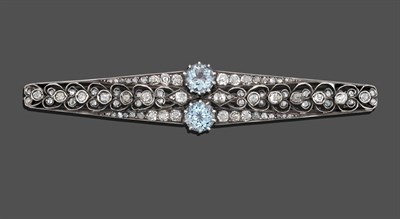 Lot 1159 - An Aquamarine and Diamond Bar Brooch, two round brilliant cut aquamarines centre a bar with old cut