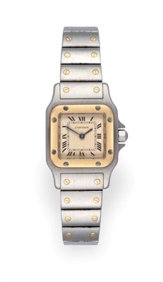 Lot 1164 - A Lady's Steel and Gold Wristwatch, signed Cartier, model: Santos, ref: 166930, circa 1995,...