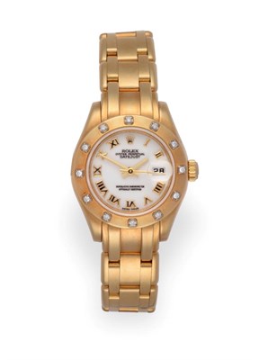 Lot 1167 - A Lady's 18 Carat Gold Diamond Set Wristwatch, signed Rolex, Oyster Perpetual, Superlative...
