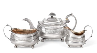 Lot 1207 - A Three-Piece George III Silver Tea-Service, by William Welch, Exeter, 1813, each piece oblong...